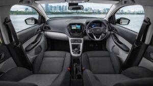 tata tiago ev का इंटीरियर व्यू जिसमें डैशबोर्ड